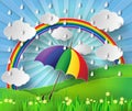 Colorful umbrella in the rain with rainbow. Royalty Free Stock Photo