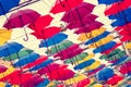 Colorful umbrellas in the air, film effects, bright spots Royalty Free Stock Photo