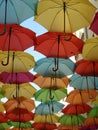 Colorful umbrellas ceiling on sunny day Royalty Free Stock Photo