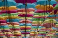 Colorful umbrellas displayed in rows