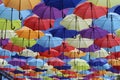 Colorful umbrellas flying in the blue sky Royalty Free Stock Photo