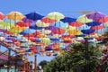 Colorful umbrellas flying in the blue sky Royalty Free Stock Photo
