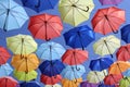 Colorful umbrellas flying in the blue sky Royalty Free Stock Photo