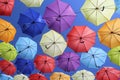 Colorful umbrellas flying in the blue sky Royalty Free Stock Photo