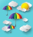Colorful umbrellas flying high in the air.