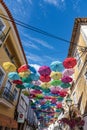 Colorful umbrellas hung over the streets of Agueda, Portugal