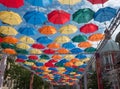 colorful umbrellas over the street in the city