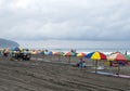 Colorful umbrellas on the sand in Parangtritis Beach, Yogyakarta, Indonesia