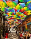 Colorful umbrellas on the street in Karakoy district in Istanbul, Turkey. Summer sunny day. Decorative, background.