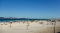 colorful umbrellas and tourists crowd the sand line at Praia do Forte in Cabo Frio, Rio de Janeiro, Brazil Royalty Free Stock Photo