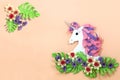 Colorful unicorn and paper flowers