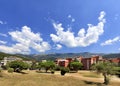 In the colorful urban valley of Montenegro white clouds float across the sky Royalty Free Stock Photo