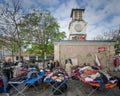 Colorful used clothing for sale at a flea market in Paris