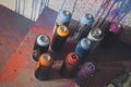 Colorful used spray paint cans. Royalty Free Stock Photo