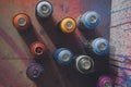 Colorful used spray paint cans. Royalty Free Stock Photo