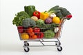 colorful variety of fresh fruits and vegetables in a fully stocked supermarket shopping cart