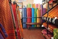 Colorful printed textiles on display in a fabric store