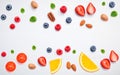 Colorful various fruits raspberry ,blueberry ,strawberry ,orange slice ,pecan ,almonds ,tomato and peppermint leaves setup on