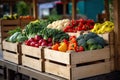 Colorful vegetable crates arranged neatly on market display. Fresh produce in wooden boxes at the food market