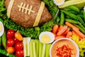 Colorful vegetable platter with meatloaf like a football ball for american football game party. Close up