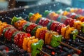 Colorful vegetable skewers grilling on a barbecue