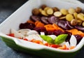 Colorful vegetables in ceramic baking dish Royalty Free Stock Photo