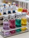 Colorful vials with scientists in a laboratory setting Royalty Free Stock Photo