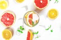 Colorful and vibrant array of citrus fruits and other exotic fruits arranged in a clear glass bowl