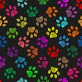 Colorful vibrant colored doodle paw prints. Seamless pattern for textile design. Paw prints white