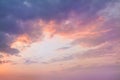 Colorful vibrant dramatic sky with purple to orange clouds. Sunset time. Beautiful nature background Royalty Free Stock Photo