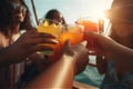 young friends toasting with tropical fruit cocktails on a sunny summer day Royalty Free Stock Photo