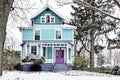 Brightly painted Victorian House Covered in Snow Royalty Free Stock Photo