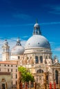 Colorful view of Basilica di Santa Maria della Salute and busy Grand Canal at sunset, Venice, Italy, summer time Royalty Free Stock Photo