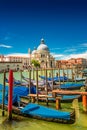 Colorful view of Basilica di Santa Maria della Salute and busy Grand Canal at sunset, Venice, Italy, summer time Royalty Free Stock Photo