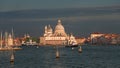 Colorful view of Basilica di Santa Maria della Salute and busy Grand Canal at sunset, Venice, Italy, summer time Royalty Free Stock Photo