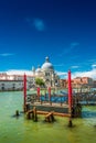 Colorful view of Basilica di Santa Maria della Salute and busy Grand Canal at sunset, Venice, Italy, summer time Royalty Free Stock Photo