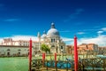 Colorful view of Basilica di Santa Maria della Salute and busy Grand Canal at sunset, Venice, Italy, summer time Royalty Free Stock Photo