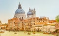 Colorful view of Basilica di Santa Maria della Salute and busy Grand Canal at sunset, Venice, Italy, summer time Royalty Free Stock Photo