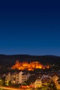 Colorful view of old downtown in Heidelberg, old bridge, statues and ancient castle during sunset, Heidelberg, Germany Royalty Free Stock Photo