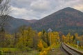 Colorful view of the slopes of wooded mountains in autumn. Royalty Free Stock Photo