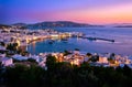 Colorful view after sunset over town of Mykonos, Cyclades, Greece, harbor and port, cruises, ship, whitewashed houses Royalty Free Stock Photo