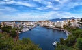 Colorful view of Voulismeni lake and Agios Nikolaos town on Crete island, Greece in evening with beautiful clouds on Royalty Free Stock Photo