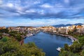 Colorful view of Voulismeni lake and Agios Nikolaos town on Crete island, Greece in evening with beautiful clouds on Royalty Free Stock Photo