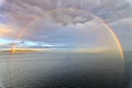 Colorful views of the rainbow against the sky, clouds and sea horizon. Commencement Bay,Tacoma,USA Royalty Free Stock Photo