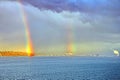 Colorful views of the rainbow against the sky, clouds and sea horizon. Commencement Bay,Tacoma,USA Royalty Free Stock Photo