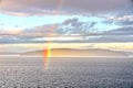 Colorful views of the rainbow against the sky, clouds and sea horizon. Commencement Bay,Tacoma,USA Royalty Free Stock Photo