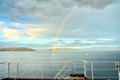 Colorful views of the rainbow against the sky, clouds and sea horizon. Commencement Bay,Tacoma,USA Royalty Free Stock Photo