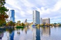 Colorful vintage fountain , business buildings and autumn trees at Lake Eola Park in Orlando Downtown area 5 Royalty Free Stock Photo