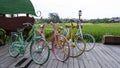 Colorful vintage old bicycle against a lush green rice field background Royalty Free Stock Photo