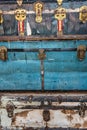 Close-up of a stack of vintage blue and white trunks